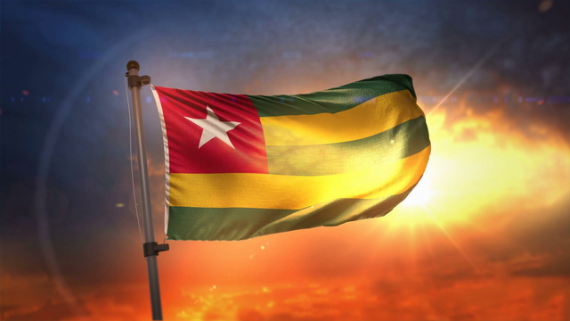 videoblocks-togo-flag-backlit-at-beautiful-sunrise-loop-slow-motion-4k_stne6auzw_thumbnail-full07.png