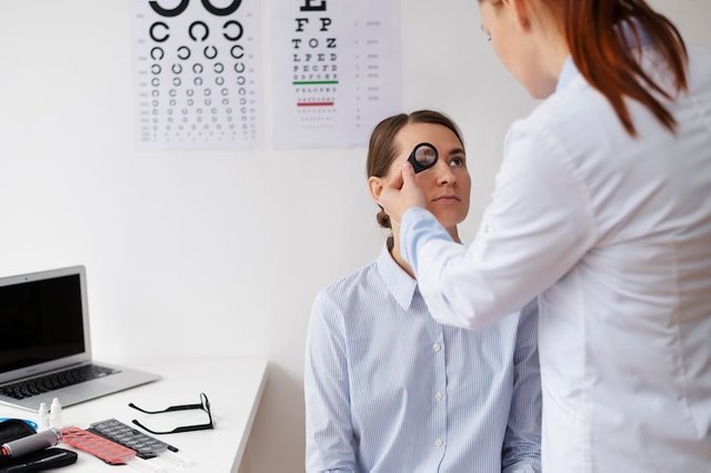 doctor-testing-patient-eyesight.jpg