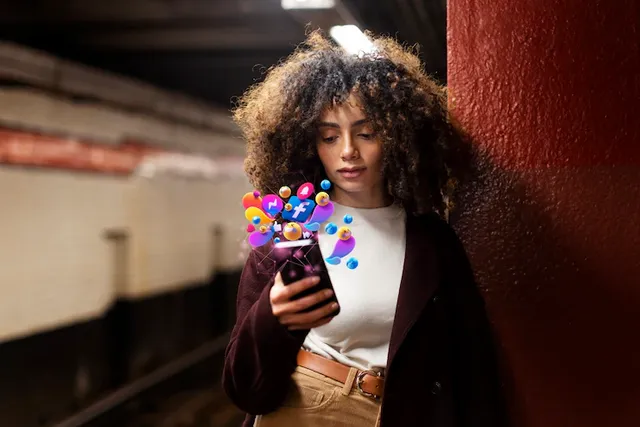 medium-shot-woman-holding-smartphone_23-2150208249.webp