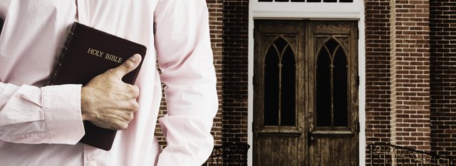 Man-with-Bible-at-church-door.jpg