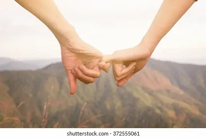 couples-hold-hands-on-mountains-260nw-372555061.webp