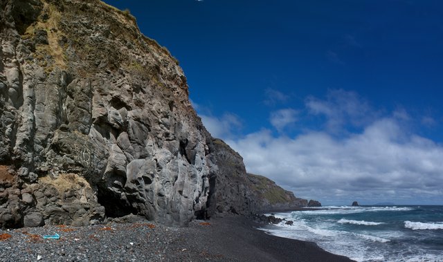 Pillow_basalt_cliffs_and_black_sand_beaches_near_the_potato_patches,_Tristan_da_Cunha.jpg