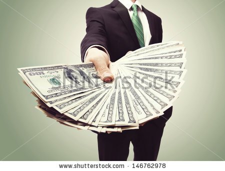 stock-photo-business-man-displaying-a-spread-of-cash-over-a-green-vintage-background-146762978.jpg