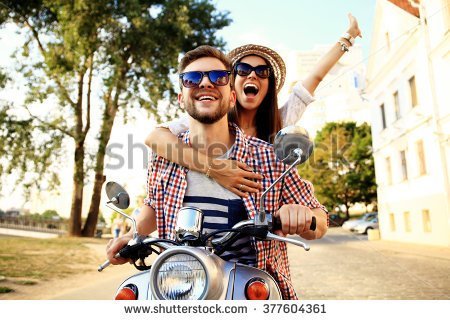 stock-photo-couple-in-love-riding-a-motorbike-handsome-guy-and-young-sexy-woman-travel-young-riders-377604361.jpg