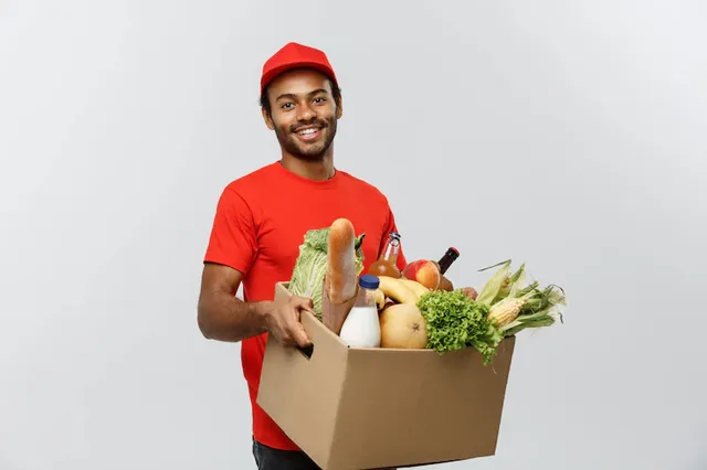 delivery-concept-handsome-african-american-delivery-man-carrying-package-box-grocery-food-drink-from-store-isolated-grey-studio-background-copy-space_1258-1232.webp