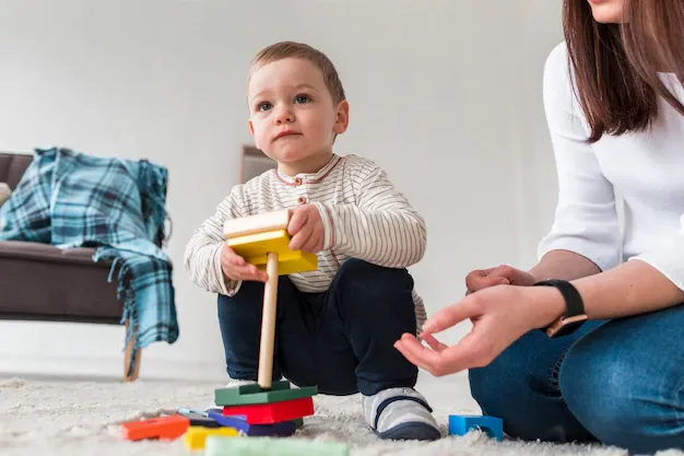 low-angle-mother-child-playing-together_23-2148463510.webp