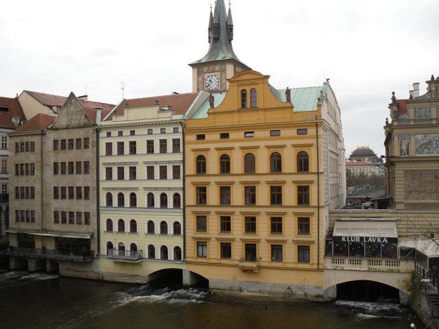 buildings with river Vltava flowing underneath.jpg