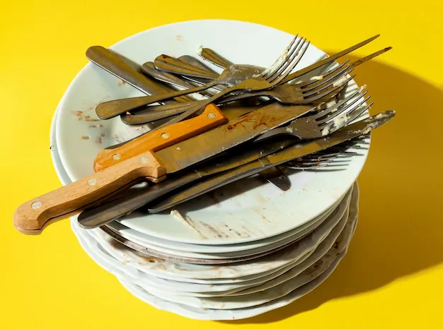 pile-dirty-plates-cutlery_23-2148748967.webp