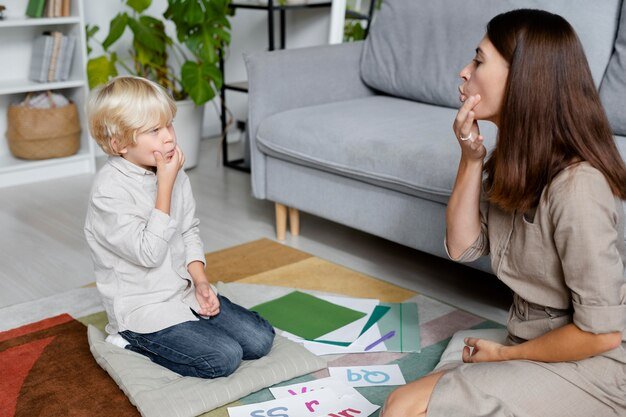 young-woman-doing-speech-therapy-with-little-boy_23-2149110214.jpg