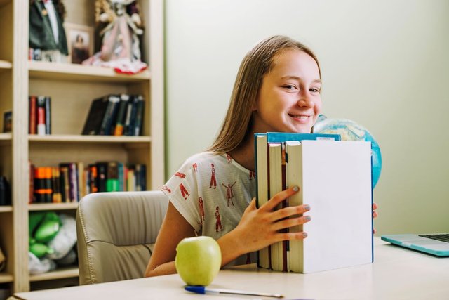 happy-teen-girl-with-books1.jpg