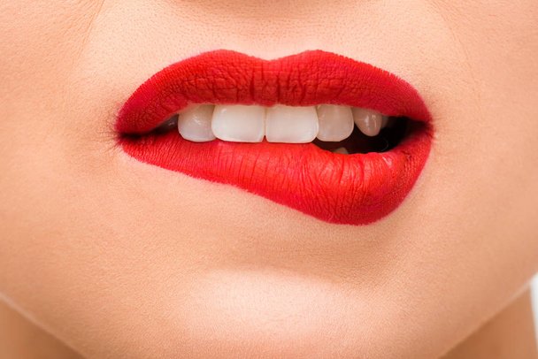 stock-photo-cropped-view-sexy-young-woman-red-lipstick-biting-lips.jpeg