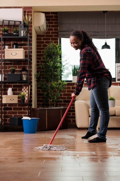 african-american-woman-mopping-floor-home-doing-housework-saturday-morning-housewife-happy-see-how-apartment-looks-like-after-spring-cleaning-housekeeping-routine_482257-51972.jpg