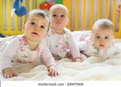 sweet-small-triplets-lying-nursery-260nw-100479604.jpg