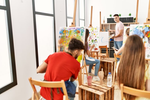 group-people-smiling-happy-having-paint-class-art-studio.jpg