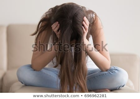 depressed-teenager-sitting-holding-head-450w-696962281.jpg