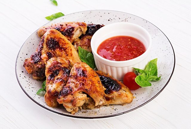 baked-chicken-wings-asian-style-tomatoes-sauce-plate_2829-10657.jpg