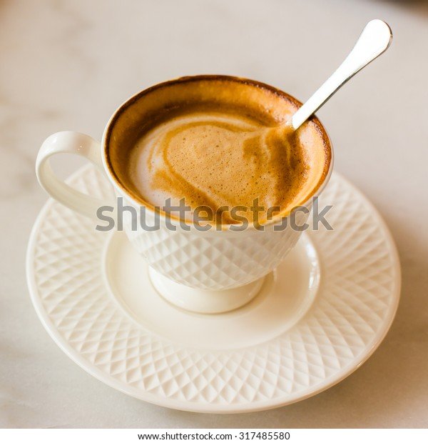 hot-art-latte-coffee-cup-600w-317485580.jpg