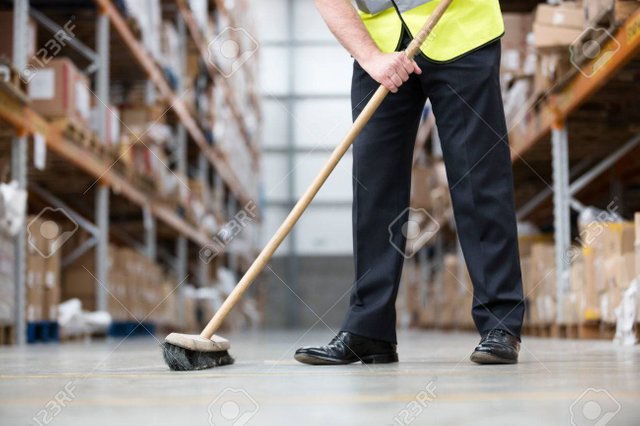 82295981-man-sweeping-warehouse-floor-with-broom.jpg