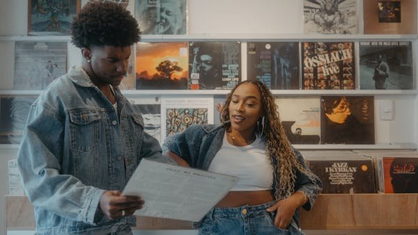 free-photo-of-couple-standing-and-reading-album.jpeg