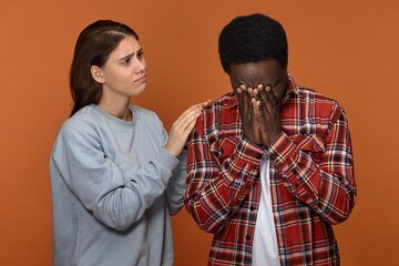 cute-compassionate-young-white-wife-comforting-consoling-her-unhappy-black-husband-who-is-crying-because-serious-problems-work-caring-european-woman-supporting-her-african-boyfriend_343059-1500.jpg