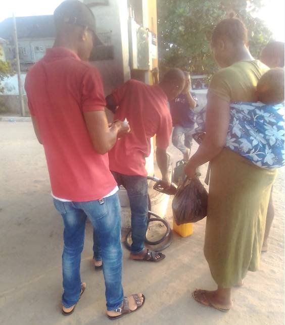 buying petrol at the feuling station.jpg