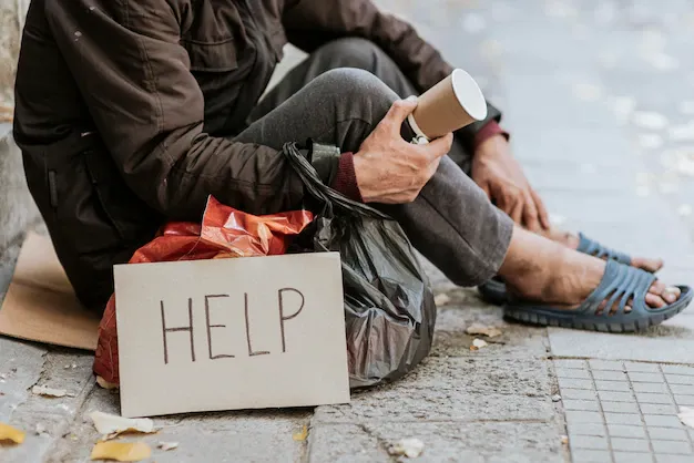 side-view-homeless-man-holding-cup-help-sign_23-2148760789.webp