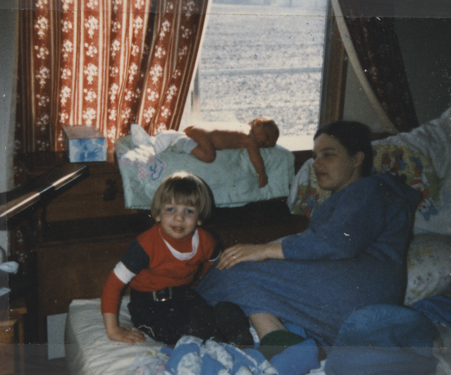 1985-02-15 apx Joey Arnold & Marilyn Mitchell & Rick & Joey bathing in Sun in Parent's Room at Window.png