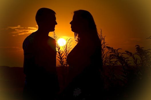 couple-love-sunset-silhouettes-160764.jpeg