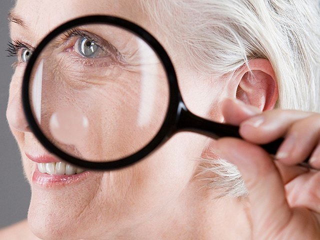 Senior-woman-using-a-magnifying-glass.jpg