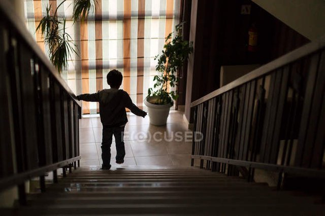 focused_142179202-stock-photo-boy-walking-down-stairs.jpg