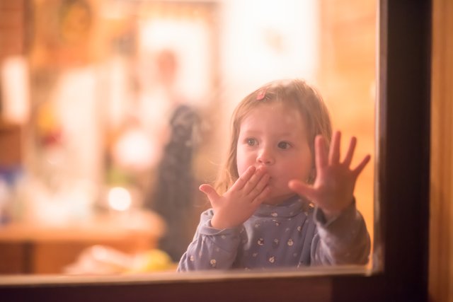 vecteezy_little-cute-girl-playing-near-the-window_11585703_57.jpg