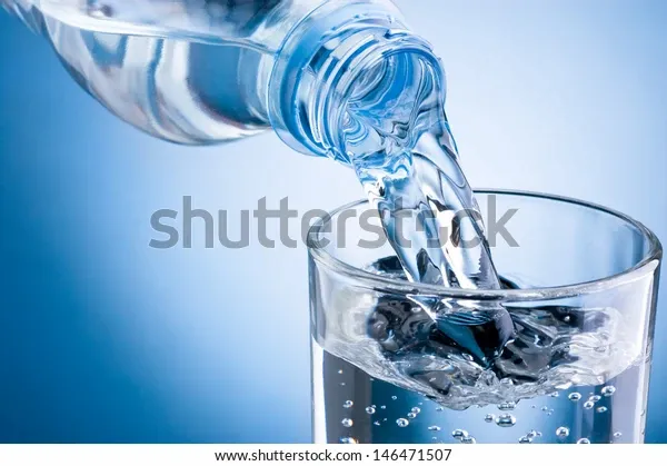 pouring-water-bottle-into-glass-600w-146471507.webp