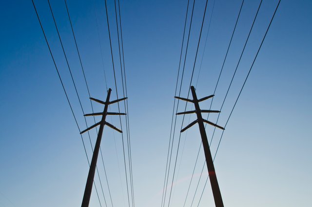 wide running power line in the blue sky.JPG