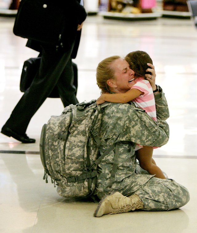 10. Terri Gurrola is reunited with her daughter after serving in Iraq for 7 months.jpg