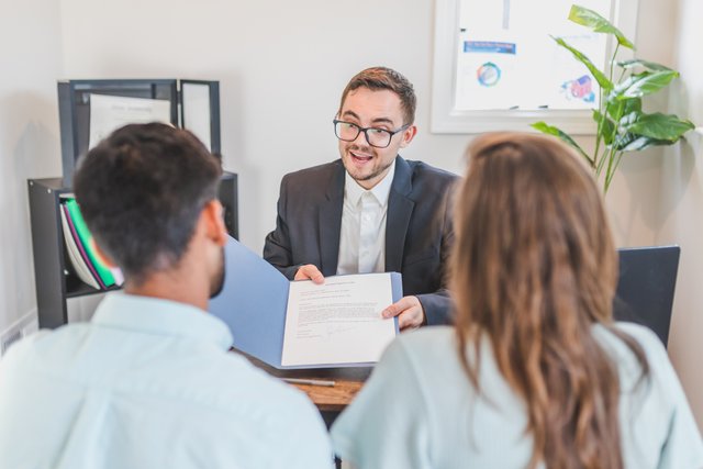 man showing file to customer.jpg