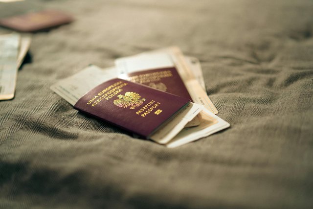 free-photo-of-polish-passport-and-travel-documents-on-bed-surface.jpeg