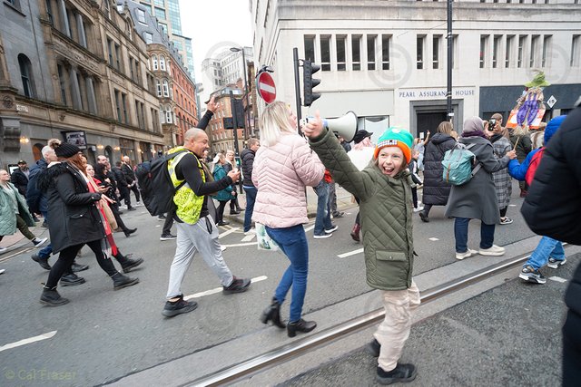 DSC04543_boy_protests_thumbs_up_upsized.jpg