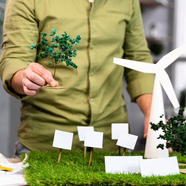 front-view-man-working-eco-friendly-wind-power-project-layout-with-wind-turbines (1).jpg