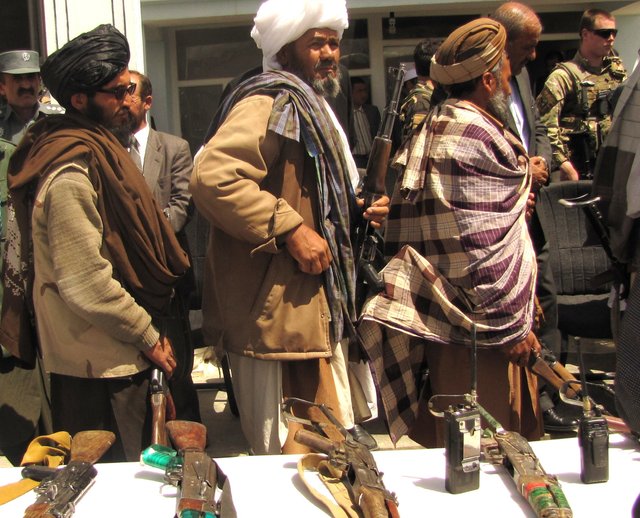 Former_Taliban_fighters_return_arms.jpg