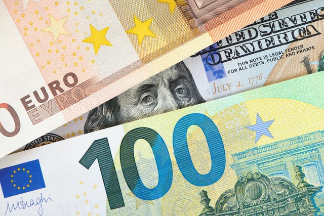 euro-dollar-notes-euro-against-dollar-closer-look-president-usa-with-dollar-bill-peeping-out-from-euro-bill-usa-europe-finance-relation-close-up-top-view_301558-993.jpg