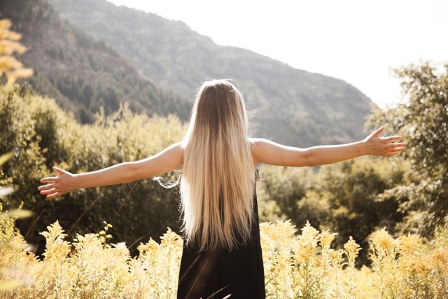 standing-man-in-black-dress-facing-mountain-757056.jpg