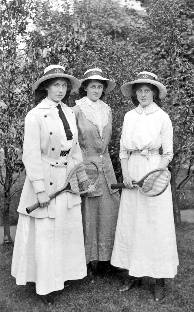 Three young women with tennis rackets.jpg