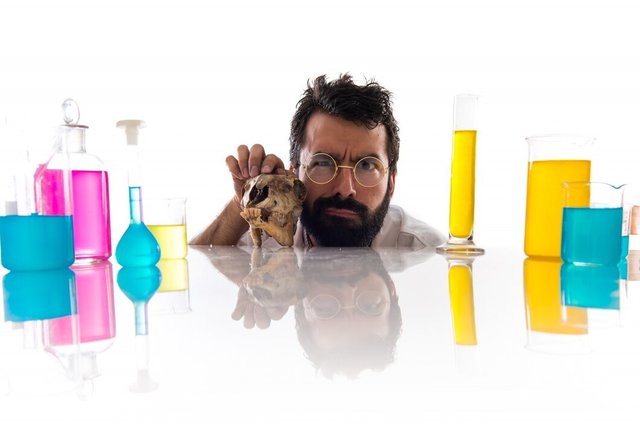 crazy-scientist-man-with-skull_1368-4779.jpg