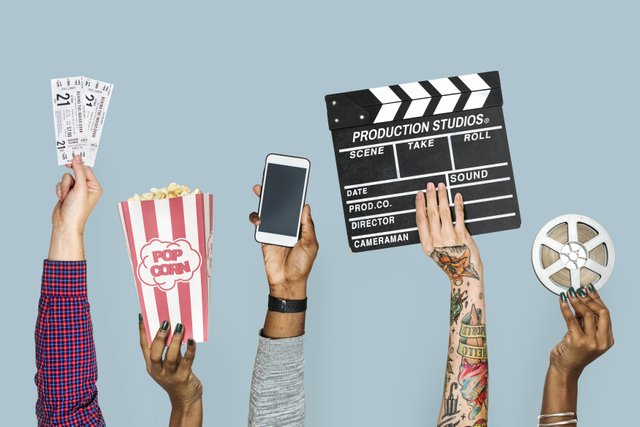hand-holding-entertainment-objects-isolated~1.jpg