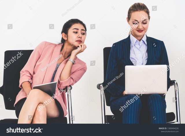 stock-photo-curious-businesswoman-looking-at-the-screen-of-laptop-computer-of-another-businesswoman-spying-1309494226.jpg