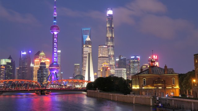 Shanghai-at-night-cityscape-skyscrapers-lights-river-bridge-China_1920x1080.jpg