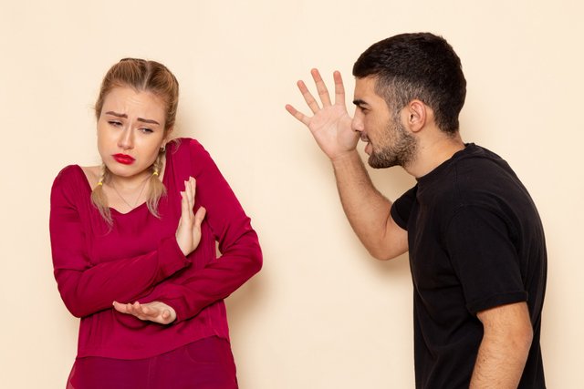 front-view-young-female-red-shirt-suffers-from-physical-threats-violence-cream-floor-female-cloth-photo.jpg