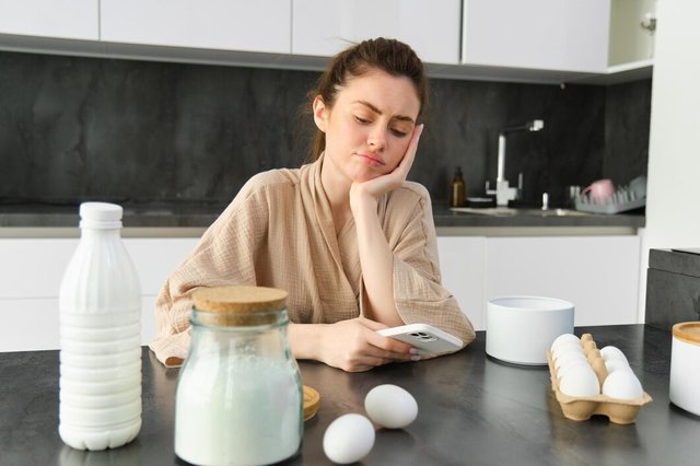 attractive-young-cheerful-girl-baking-kitchen-making-dough-holding-recipe-book-having-ideas_1258-193290.jpg