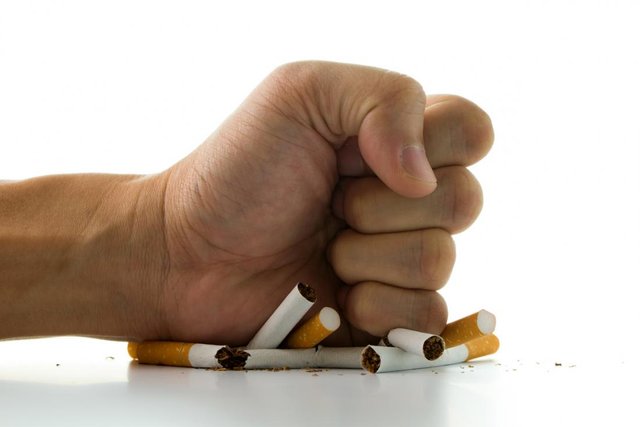 man-s-hand-crushing-cigarettes.jpg