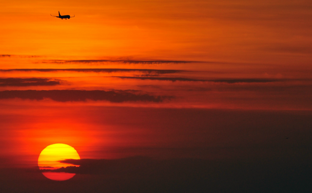 plane_above_sunset.png